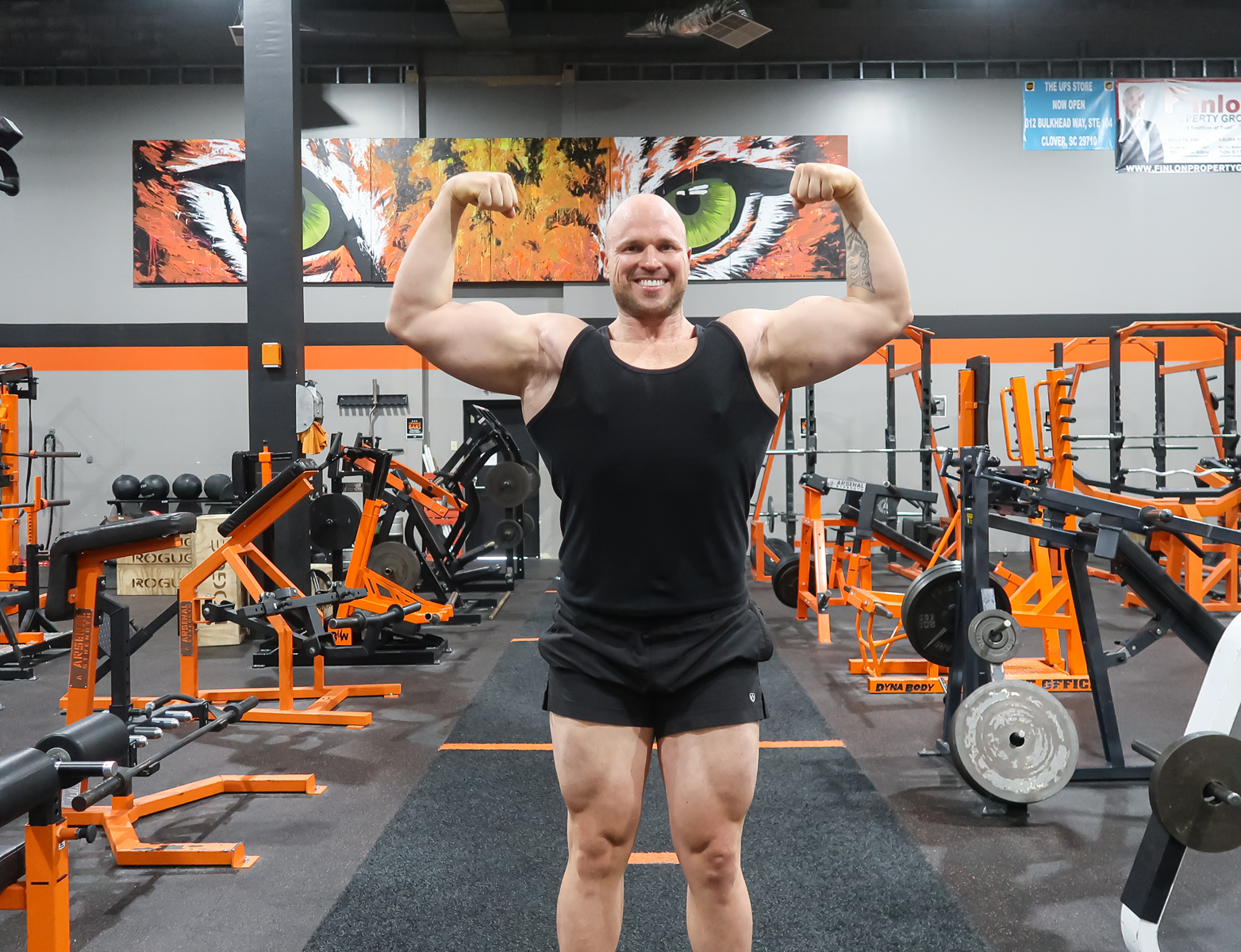 Coach is posing with his muscle.